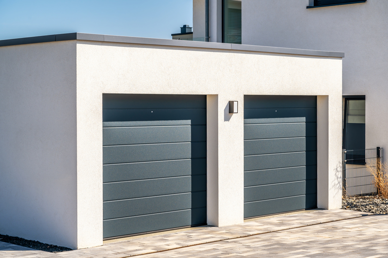 how do sectional garage doors work